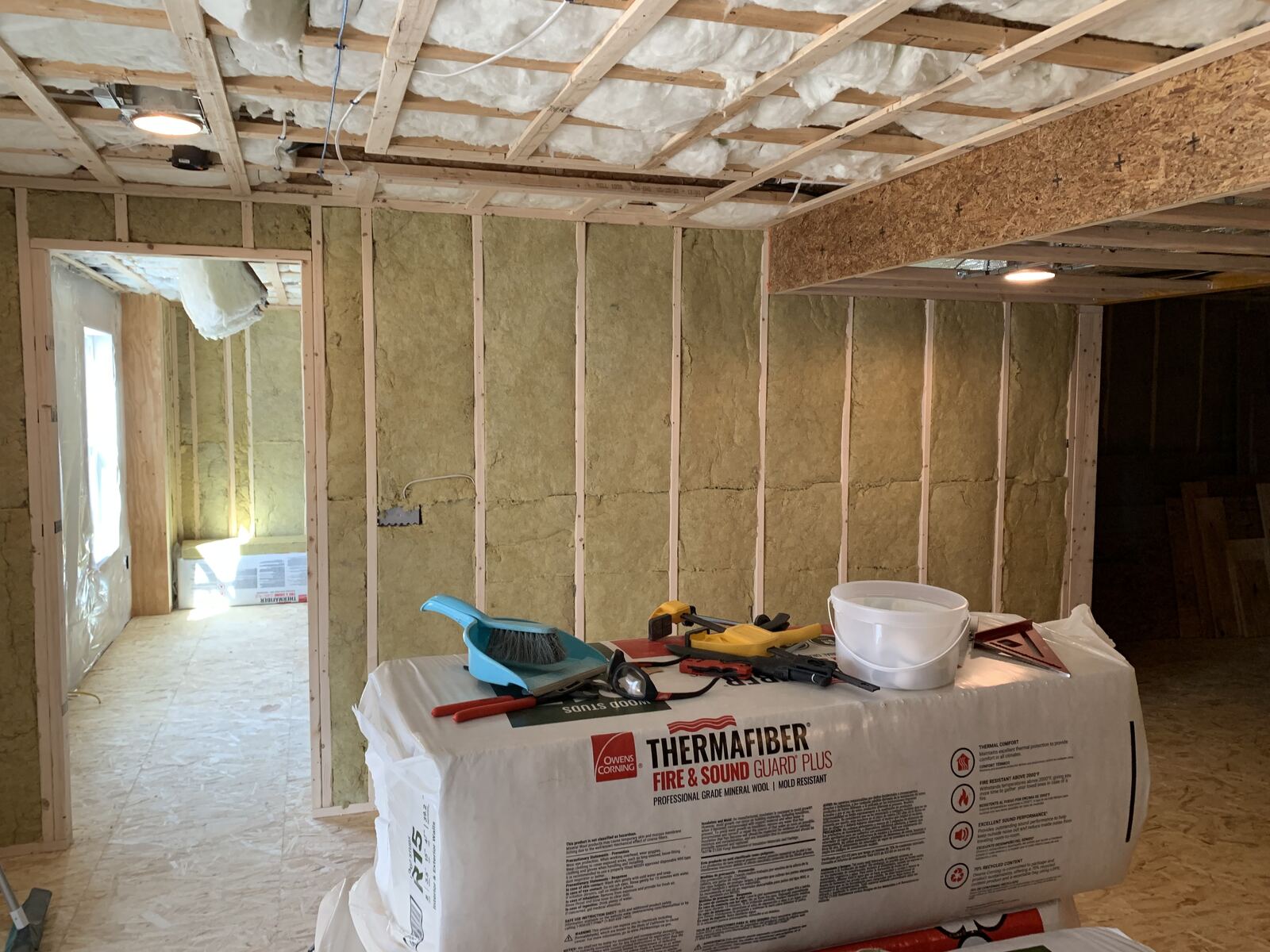 Framed room with mineral wool insulation installed in the walls